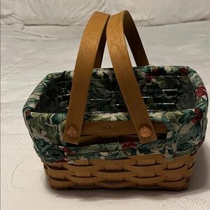 Longaberger small basket with swinging handles and lined with holiday print